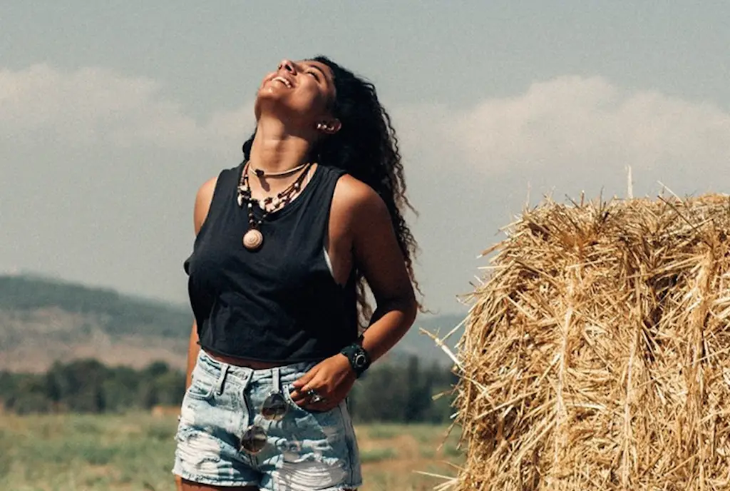 Woman in the the countryside doing breathwork